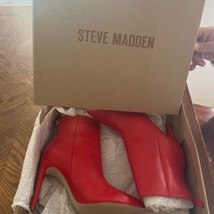 Steve Madden fire red high heel boots . Never worn on clearance sale.